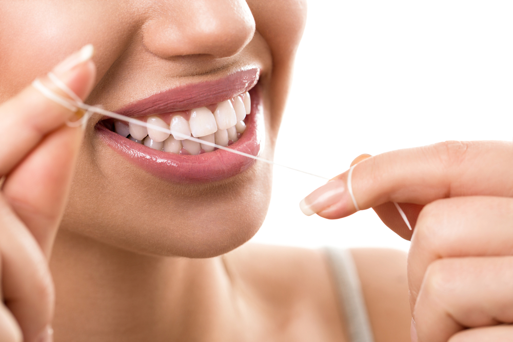 Cleaning teeth with dental floss