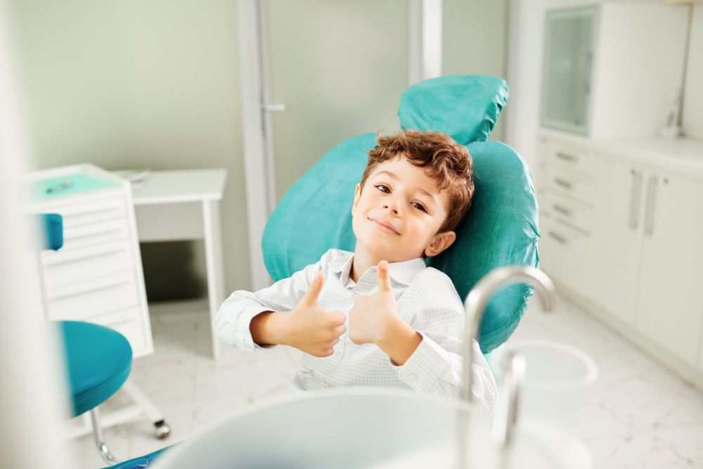 Boy at the Dentist Showing Thumbs Up