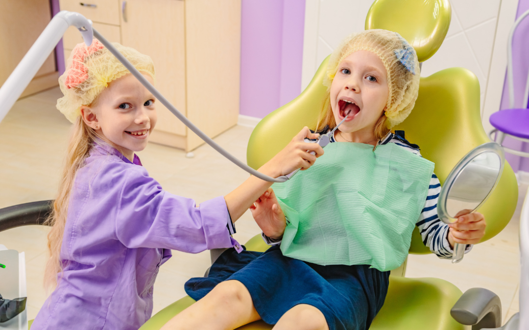 two kids playing on a dentist chair