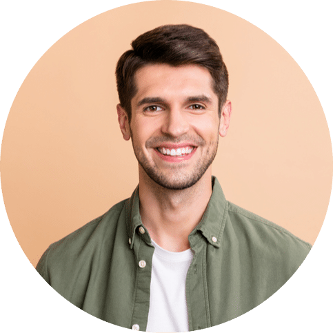 Man smiling with clean, white teeth against a neutral background