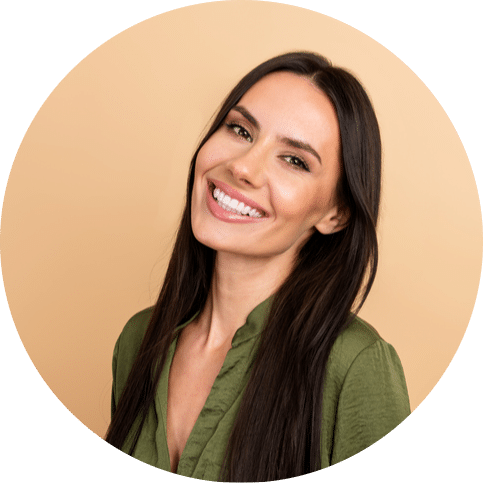 Woman smiling with long dark hair against a neutral background